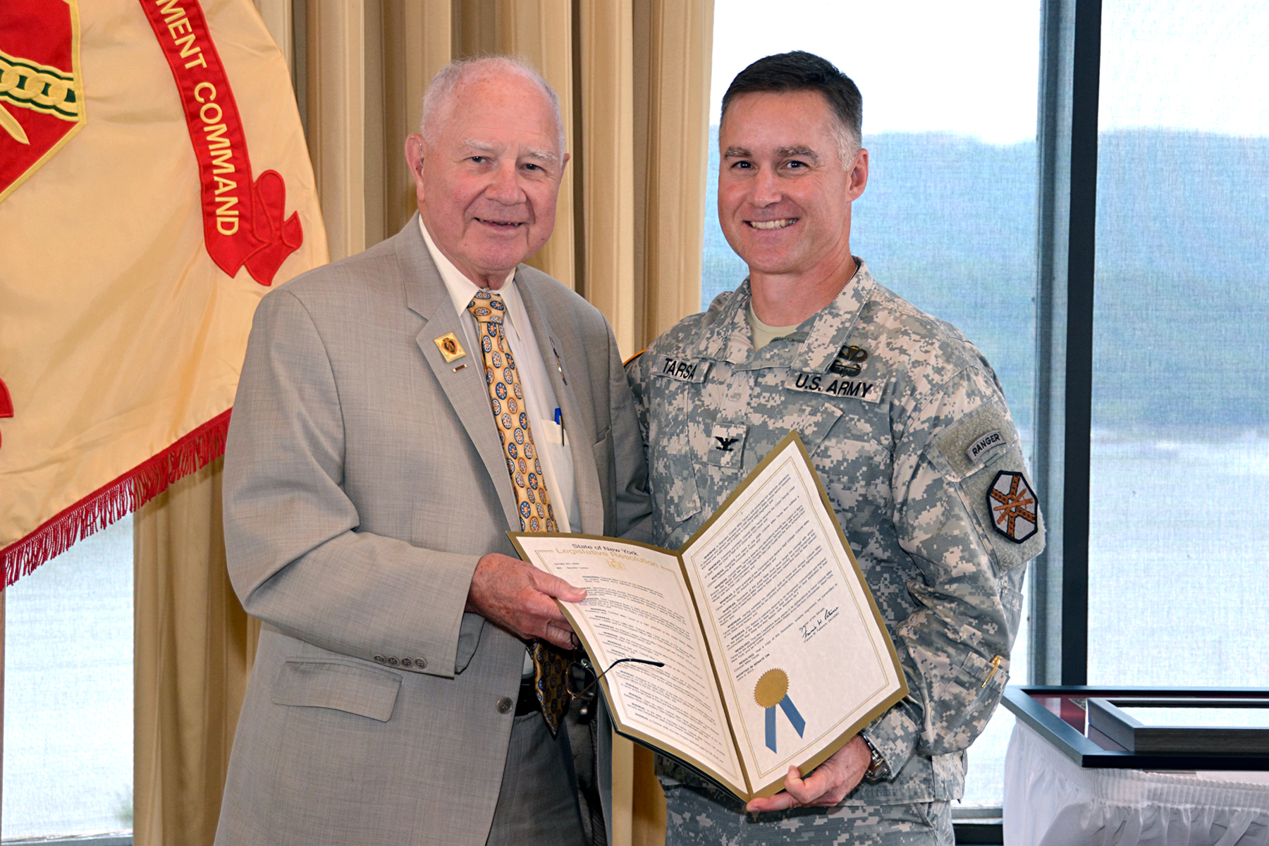 Senator Bill Larkin presents Colonel Mike Tarsa with a Legislative ...