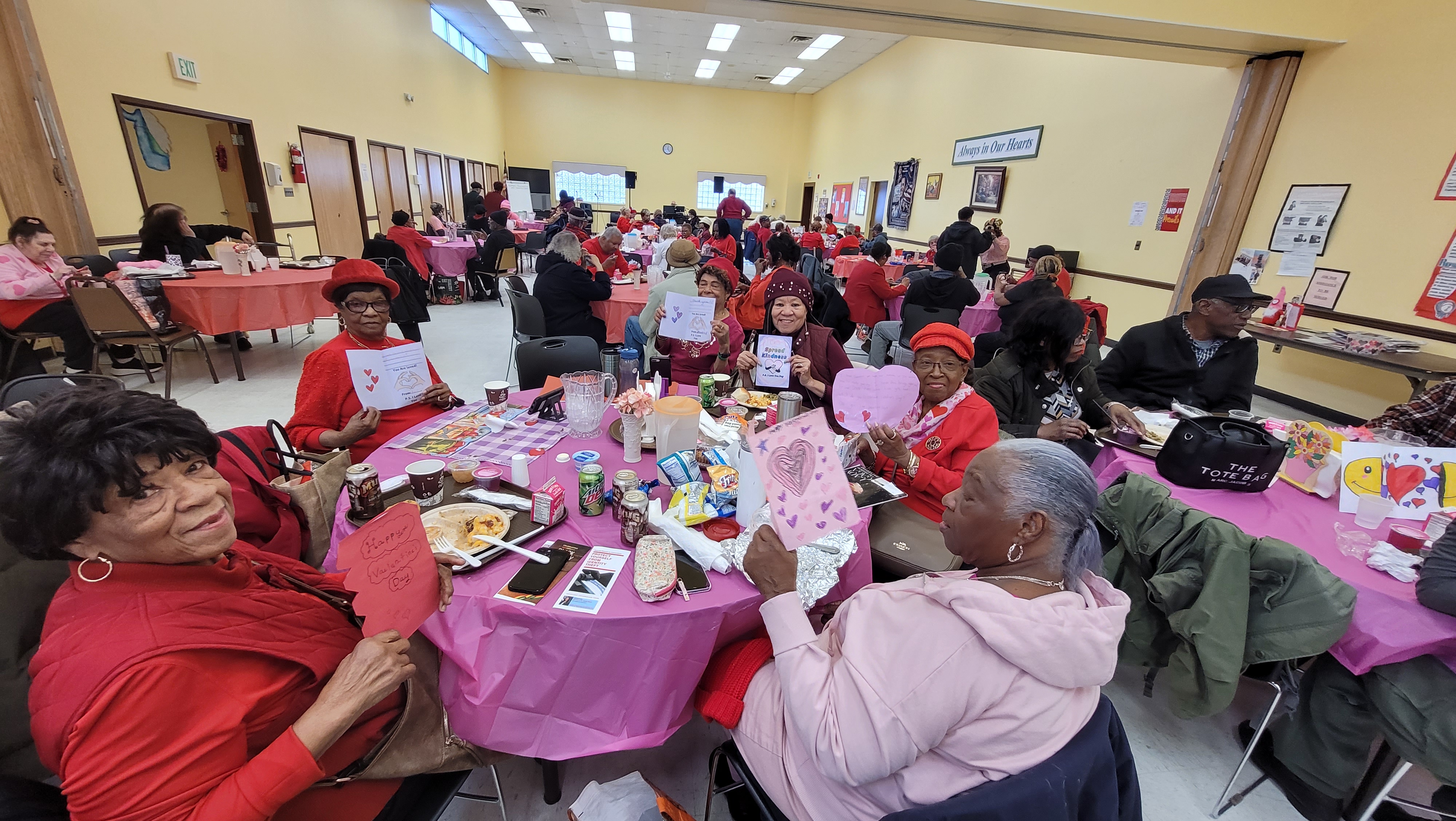 Seniors at the Wyandanch Senior Nutrition Center receive cards from NYS Senator Monica R. Martinez made by local school aged children.