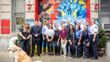 Sen. Gounardes poses with members of the station house at the unveiling of the new mural.