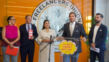 Senator Andrew Gounardes speaks at the Freelancers Union office with other elected officials.