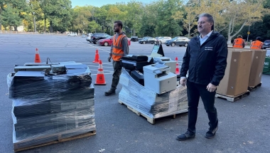 Senator Addabbo checks out some of the e-waste that was collected.