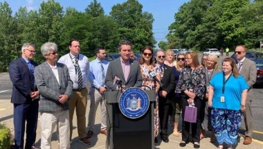 Senator James Skoufis in front of Monroe-Woodbury Middle School in June