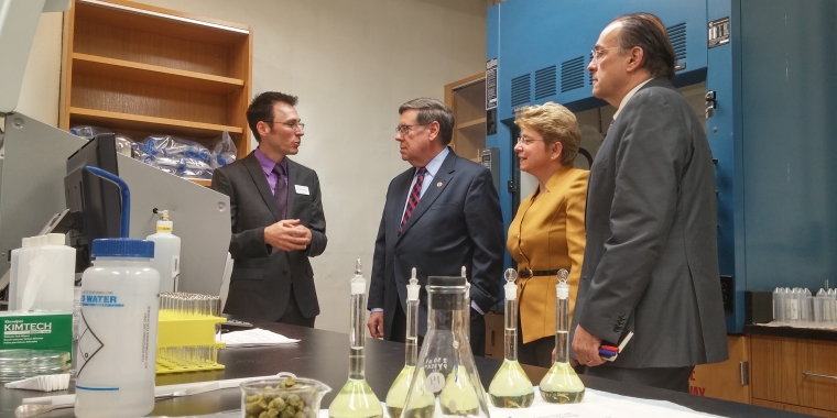 From left, Hartwick College Center for Craft Food & Beverage Director Aaron MacLeod explains the inner workings of the center's lab to Senator James Seward, Hartwick College President Margaret Drugovich, and New York State Department of Agriculture and Markets Deputy Commissioner Phil Giltner.