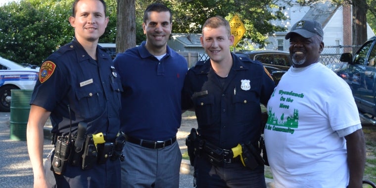 Senator Venditto with police officers from the Suffolk County Police Department First Precinct and a Wyandanch resident