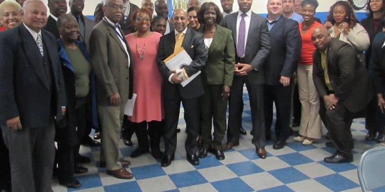Ron Spinelli of Con Ed, fifth from right, and Levar Haffoney, sixth from right, were the guest speakers at this month's Community Clergy Breakfast.