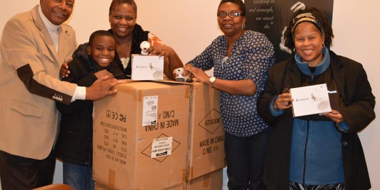 Senator Sanders donates more than 2,000 web cams to schools in his district. He is joined by District 29 Presidents' Council President, Yvette Small, District 29 Presidents' Council Recording Secretary, Karine Lawrence, the former President of the PTA Presidents' Council of District 29, Lorraine Bridges, and a young student.