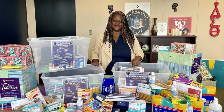 Senator Lea Webb with donated school supplies