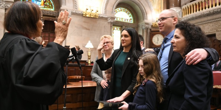 Former state Sen. Diane Savino, right, attends the swearing in ceremony of her successor and former staffer Jessica Scarcella-Spanton