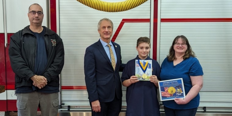 Senator Sean Ryan presents New York State Senate Liberty Medal to Jayden Gersitz and poses with Jayden's parents, Jeremiah and Kristen Gersitz, Nov. 14, 2023