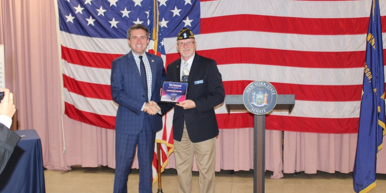 Senator Skoufis presenting Colonel Holshek with the VHOF plaque