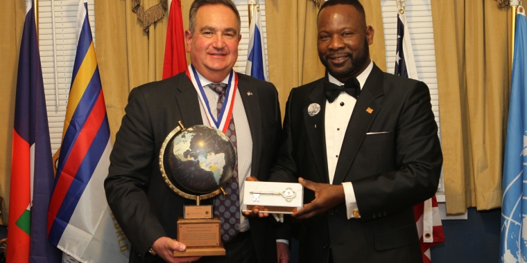 Sen. Borrello and Ambassador Sanon during the Award Presentation