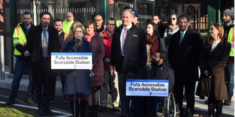 NEW YORK ––The Metropolitan Transportation Authority (MTA) announced that the Scarsdale Metro-North Station has been made fully accessible with the opening of a second elevator, in an enclosed tower, that serves the Grand Central-bound platform. As part of the improvement project, the overpass was raised seven inches to provide greater vertical clearance for Metro-North work trains and was enhanced with new customer amenities. 