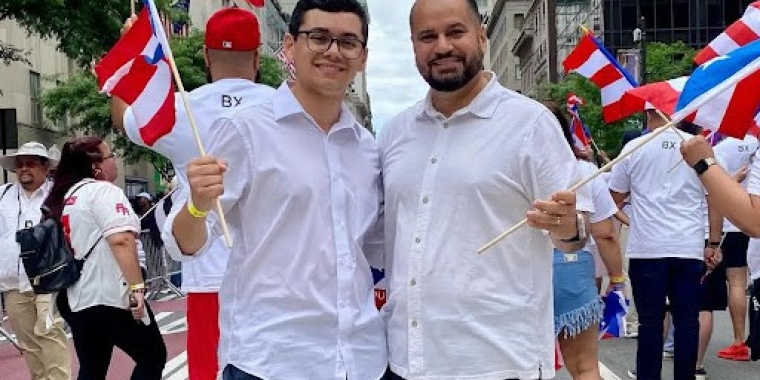 Senator Serrano at the National Puerto Rican Day Parade, waving Puerto Rican Flag