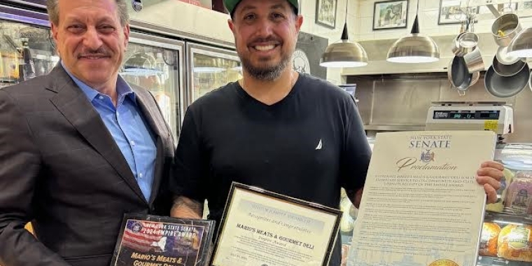 Senator Addabbo presents awards to Joe DiGangi, the owner of Mario’s Meat Market and Gourmet Deli.