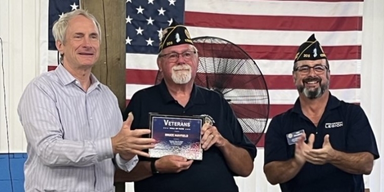 Senator Sean Ryan presents Bruce Mayfield with a plaque commemorating his induction into the New York State Senate Veterans' Hall of Fame, July 25, 2024.
