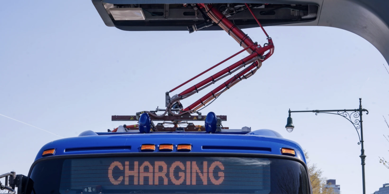 An electric MTA bus being charged.