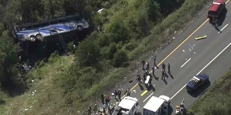 Emergency responders work the scene of a bus crash in Wawayanda on Sept. 21, 2023. The charter bus carrying high school students to a band camp hurtled off a New York highway and down an embankment, killing two people and hurting dozens of others, officials said.