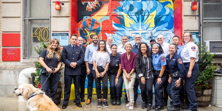 Sen. Gounardes poses with members of the station house at the unveiling of the new mural.