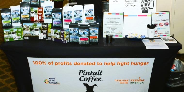 Photo of a Pintail Coffee company display table with products during a Senator Monica R. Martinez community event.