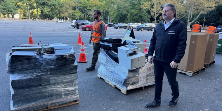 Senator Addabbo checks out some of the e-waste that was collected.