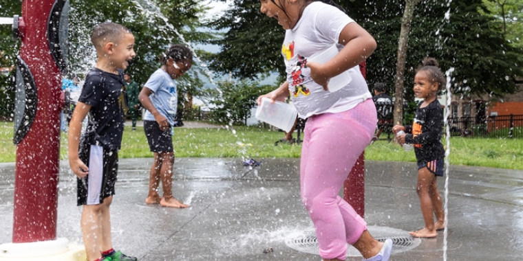 Children beating the heat on a splash pad (file)