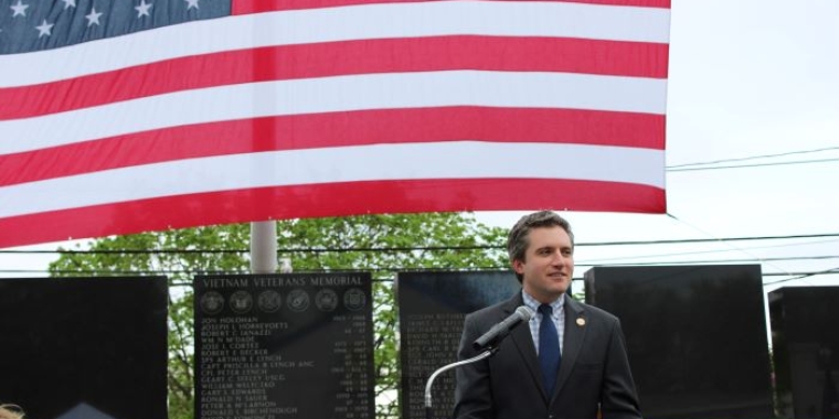 Senator James Skoufis speaks at the dedication of the Town of Wallkill's Vietnam Veterans Wall Memorial in May.