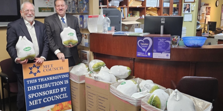 Senator Addabbo accepts a large turkey donation from Met Council represented by Managing Director, of Legal & External Affairs, Aaron Cyperstein