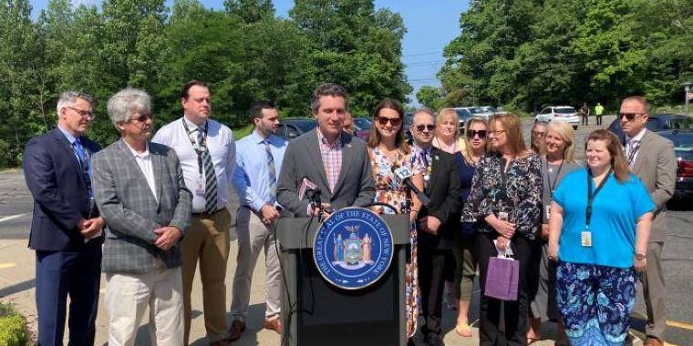 Senator James Skoufis in front of Monroe-Woodbury Middle School in June