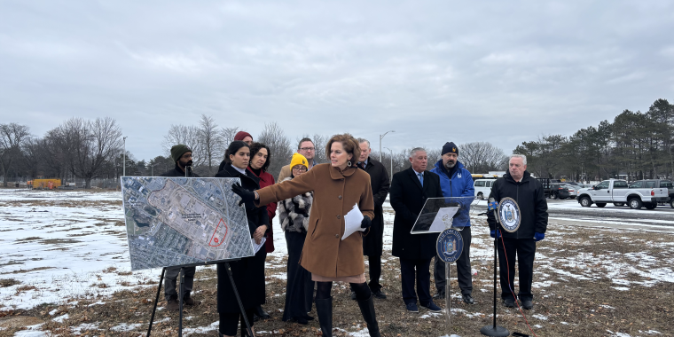 Senator Fahy is joined by local elected officials as she points on a map to where the Wadsworth Project will be located on the Harriman State Office Campus.