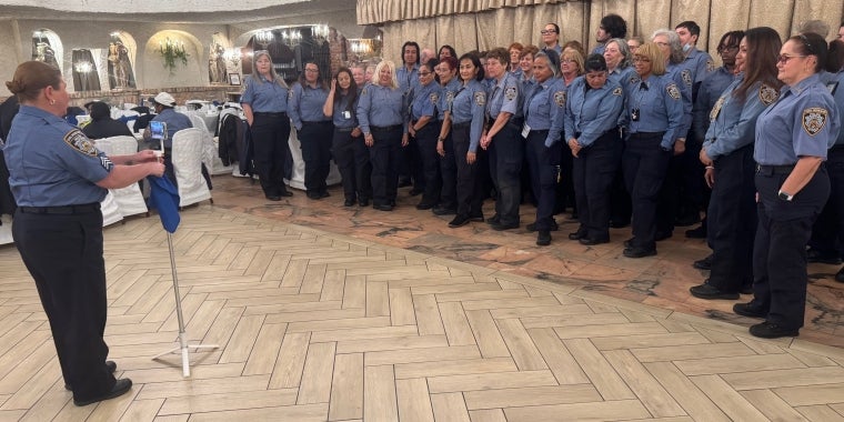The crossing guards happily posed for photos. The crossing guards happily posed for photos.