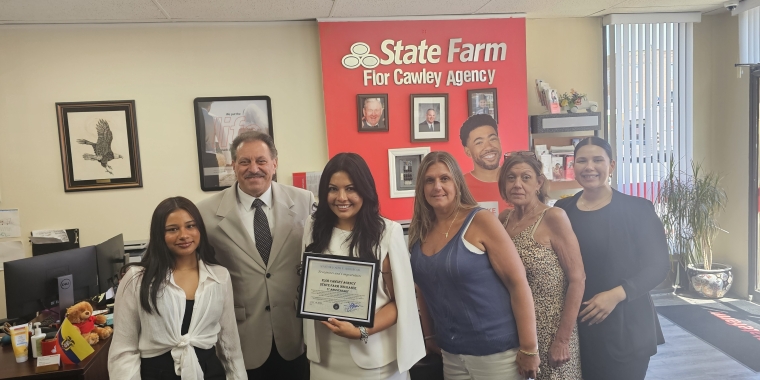 Senator Addabbo presented a citation to State Farm agent, Flor Cawley, third from left, and her staff on their fifth anniversary, and recognized Maria Gengo, second from right, for her 30 plus years with the company.