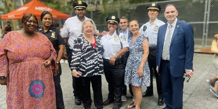 Senator Krueger stands with officers and community members from the 17th Precinct
