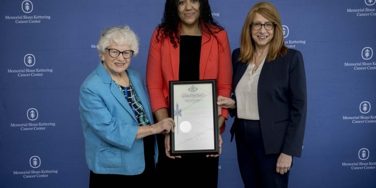 Senator Stavisky, Assemblymember Rosenthal, and Dr. Smith A photo of Senator Toby Ann Stavisky, Assemblymember Linda B. Rosenthal, and Dr. Cardinale Smith (Chief Medical Officer), holding the signed pen certificate of the Scalp Cooling Insurance Law
