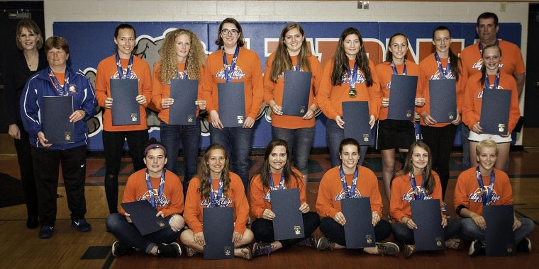 Senator Young presents members of the Class B State Champion Livonia Lady Bulldogs with New York State Resolutions in their honor.