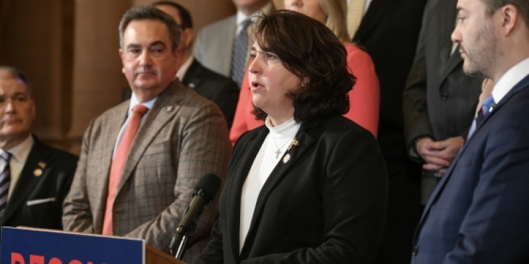 Senator Canzoneri-Fitzpatrick at podium standing with Members of the NYS Senate Republican Conference.