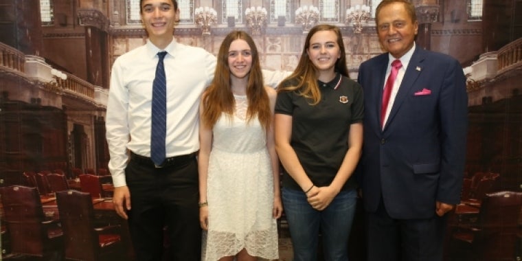 Senator Bonacic is pictured with (L-R); Salutatorian, James Maley; Valedictorian, Mara Frisbee; and Salutatorian, Faith Barich.