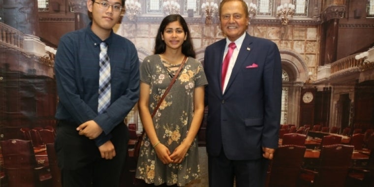 Senator Bonacic is pictured with (L-R); Valedictorian, Ray Lin and Salutatorian, Reham Perry.