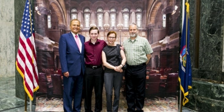 Senator Bonacic is pictured with (L-R), Valedictorian Arik Mozejko, Arja Mozejko and Peter Mozejko.