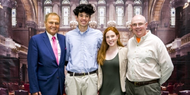 Senator Bonacic is pictured with (L-R), Valedictorian Joshua Berry, Salutatorian Stephanie Stewart Hill and her father Stephen Stewart Hill.