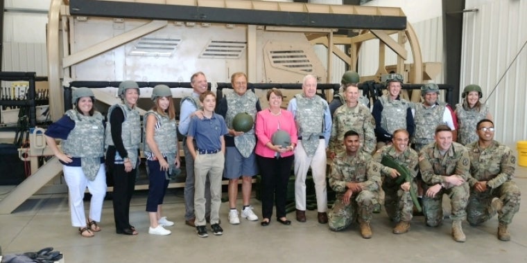 Senator Bonacic (center, with helmet) is pictured with soldiers from Fort Drum and several colleagues from the legislature including, Assemblyman Will Barclay, Senator Patty Ritchie, and Senator Kemp Hannon.