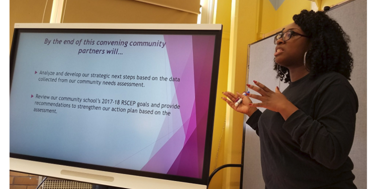 Community School Director Kenya George leads the conversation at 5th Annual Community Cares Breakfast