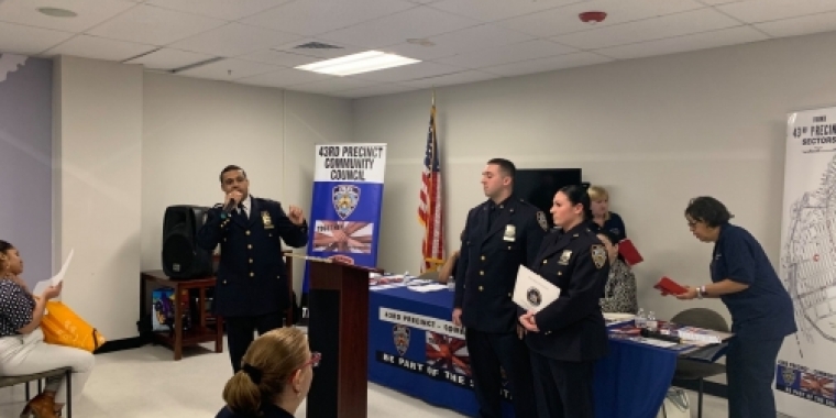 Awards are presented to Officers Katie Cameron and Christopher Regan