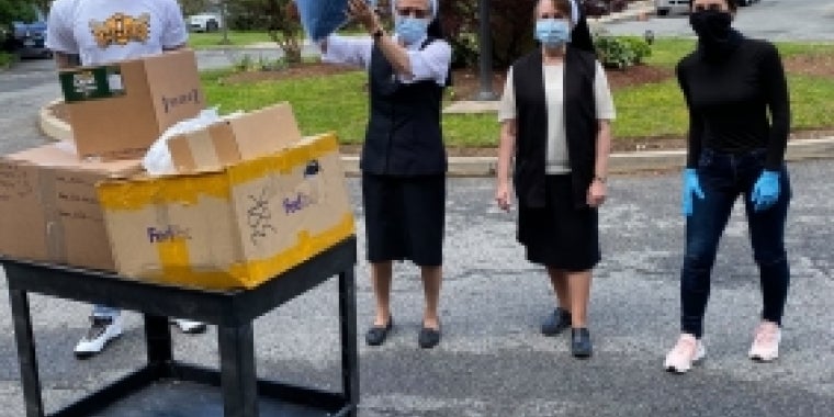 Senator Biaggi delivering PPE with James Nolan and others