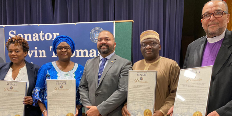 Senator Kevin Thomas, center, presenting New York State Senate Proclamations to (from the left) Detective Sergeant Ieda McCullough, Isoken Irowa, Uhumwnamure Lucky Irowa, and Apostle J. Raymond “Megalos” Mackey, I.