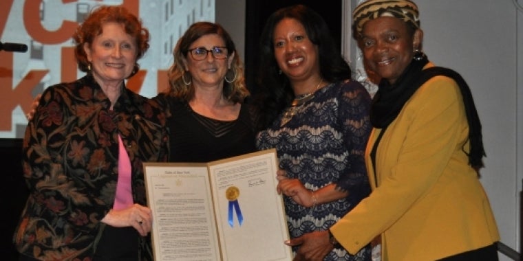 Senator Montgomery and Assemblywoman Simon present Legislative Resolution honoring the YWCA of Brooklyn to Martha Kamber, President and CEO, and Rolanda Telesford, Director of Outreach & External Relations