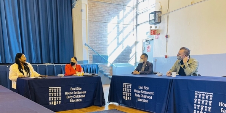 Legislators at table with childcare providers