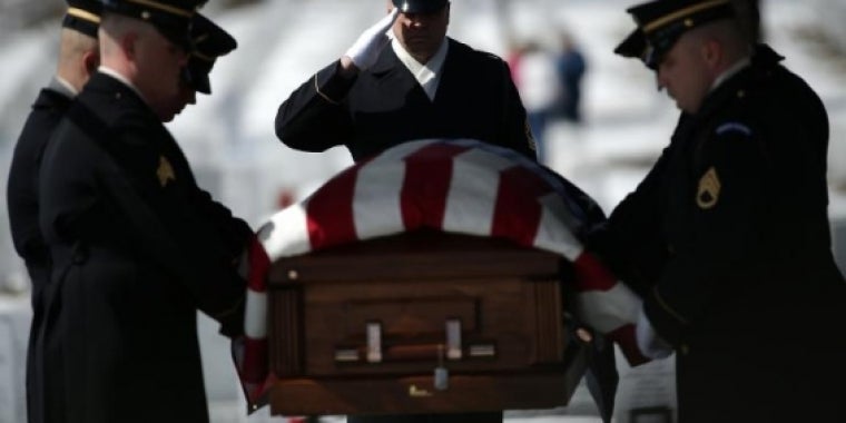 An honor guard moves the remains of U.S. Army Air Forces Tech Sergeant Charles Johnston to his burial site at Arlington National Cemetery March 2, 2015, in Arlington, Virginia. On Monday, New York state Senator John Brooks introduced a new bill offering free tuition to Gold Star families. WIN MCNAMEE/GETTY IMAGES Military Funeral with Full Honors