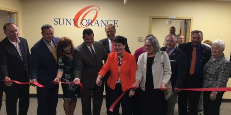 Senator Bonacic joins local officials in cutting the ribbon at the Sarfatti Education Center. Pictured (L-R); Steve Sarfatti; Orange County Executive, Steve Neuhaus; Orange County Clerk, Annie Rabbitt; City of Port Jervis Mayor, Kelly Decker; Senator Bonacic; SUNY Orange President, Dr. Kristine Young; Chair of the SUNY Orange Board of Trustees, Helen Ullrich; Orange County legislator, Tom Faggione; Orange County Legislator, Paul Ruszkiewicz; and SUNY Orange Trustee, Sister Peggy Murphy.