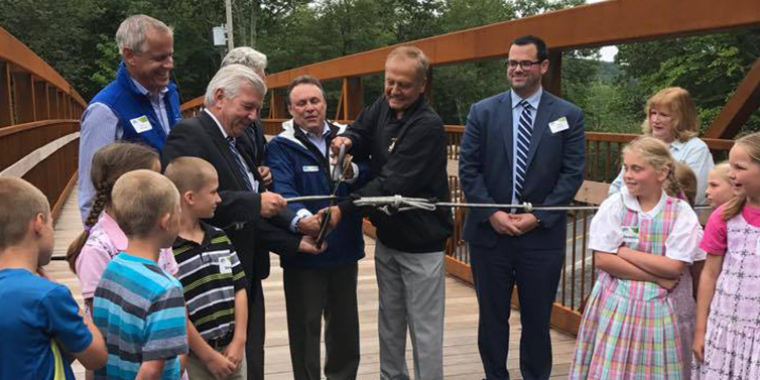 Senator Bonacic join local and state officials in cutting the ribbon on the new Trapps Bridge.
