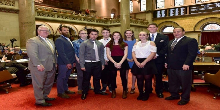 In the Assembly Chamber, from left to right: Senator O’Mara, Travis Durfee, Zachary Burrows, Patrick Madaffari, James Jensen, Haley Dean, Ali LaMoreaux, Isabella Bond, David Armstrong, and Assemblyman Palmesano.